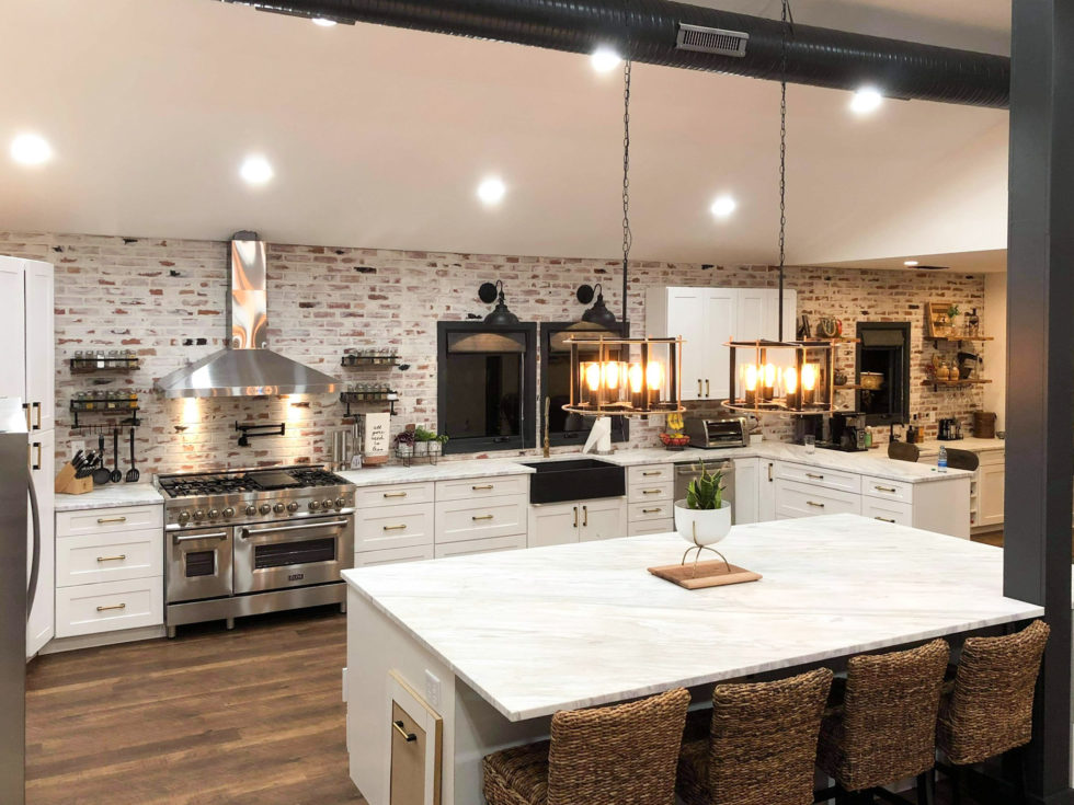 Kitchen with exposed brick and marble surfaces