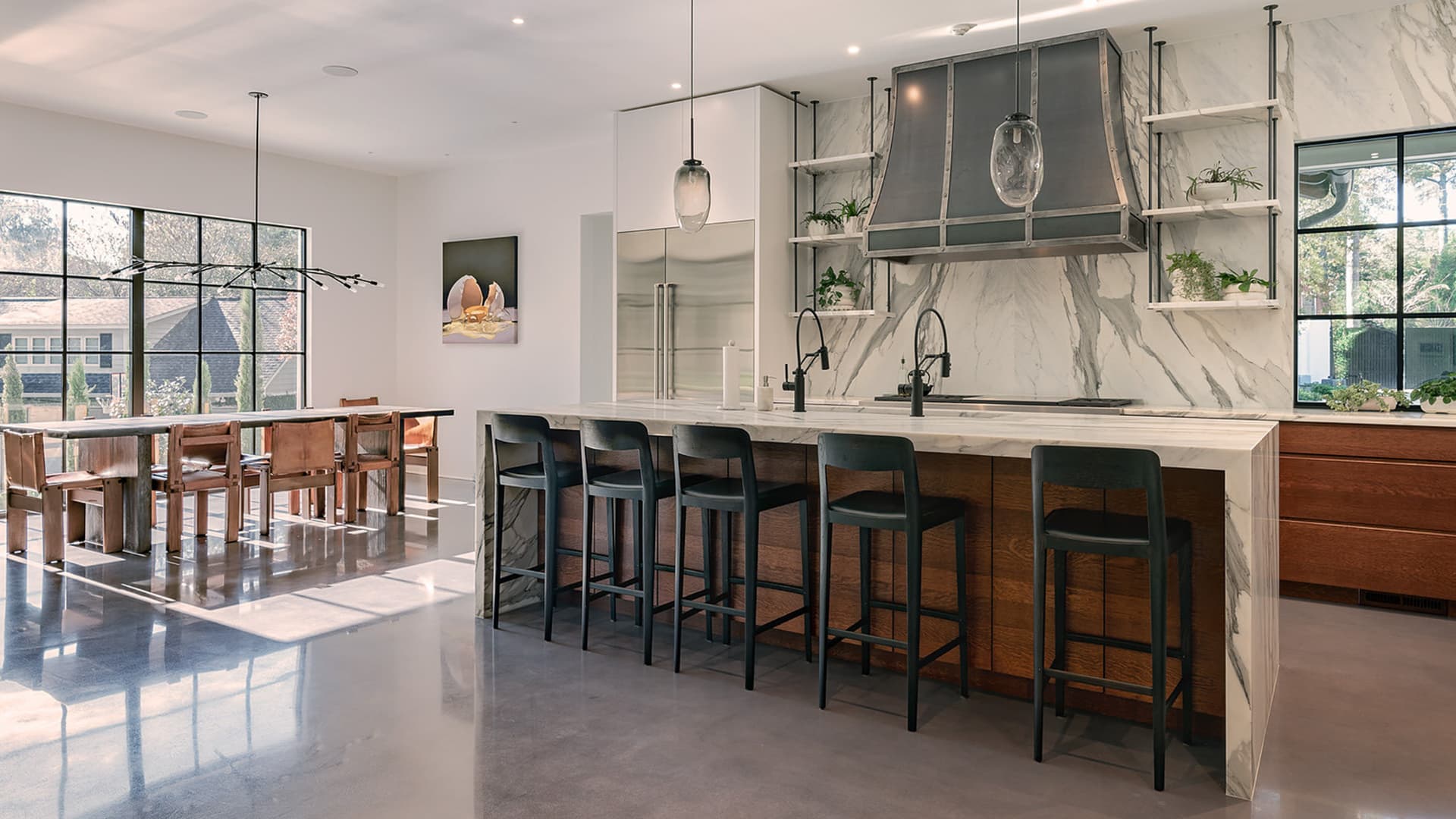 Italian marble kitchen with dramatic veining and a marble waterfall island